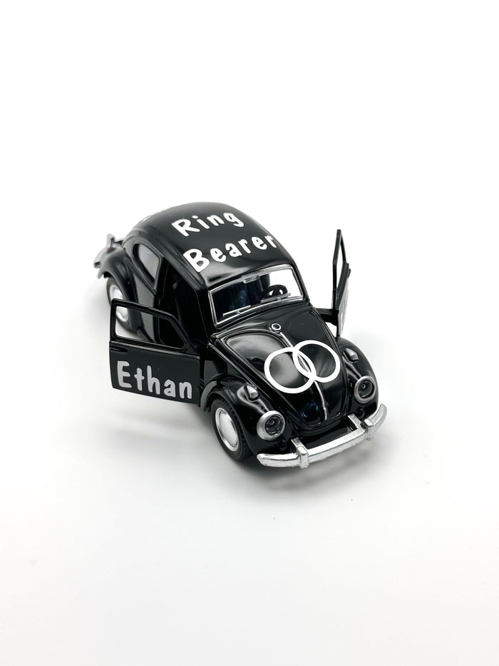 personalized ring bearer black car, ages 3+, die-cast car for ring security, not a toy, wedding boy memento. personalized with white premium vinyl, ring design on the hood, title on the top and name on the doors, date on the back of the car.