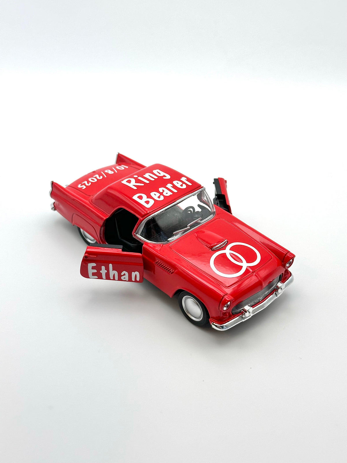 personalized ring bearer red car, ages 3+, die-cast car for ring security, not a toy, wedding boy memento. personalized with white premium vinyl, ring design on the hood, title on the top and name on the doors, date on the back of the car.